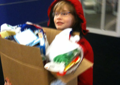 A person carrying a box of goodies